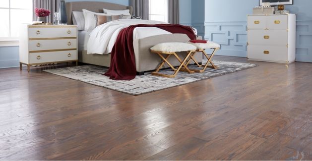 walnut hardwood in modern bedroom by Carpet One Floor & Home
