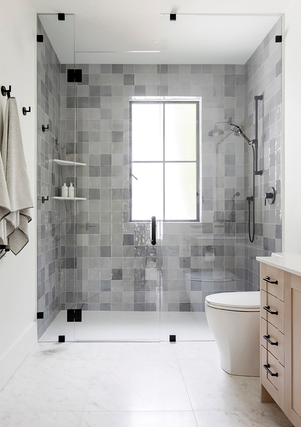 walk in bathroom shower with wall tile. Design by Knight Varga Interiors | Photography by Janis Nicolay 